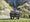 Couple sitting in Lawn Chariot watching a waterfall